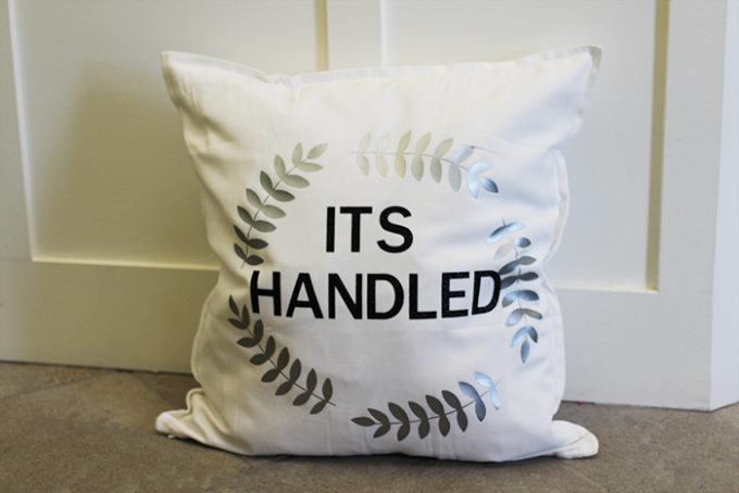 throw pillow with "its handled" a quote from scandal tv show