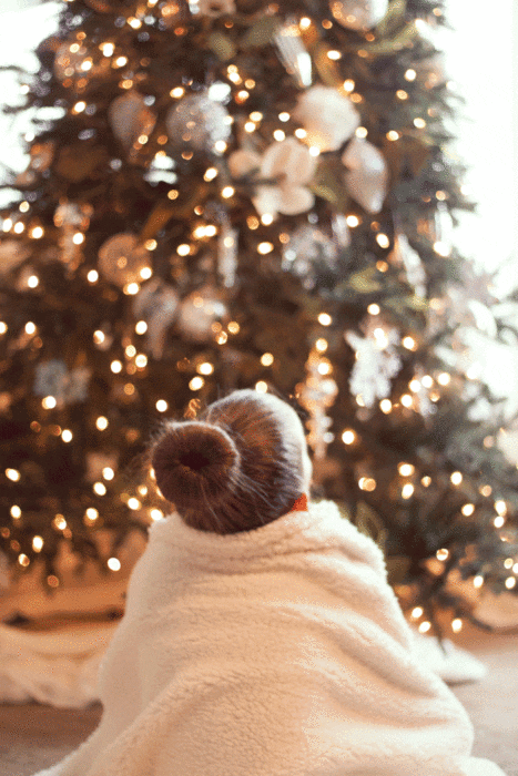 girl-in-front-of-christmas-tree