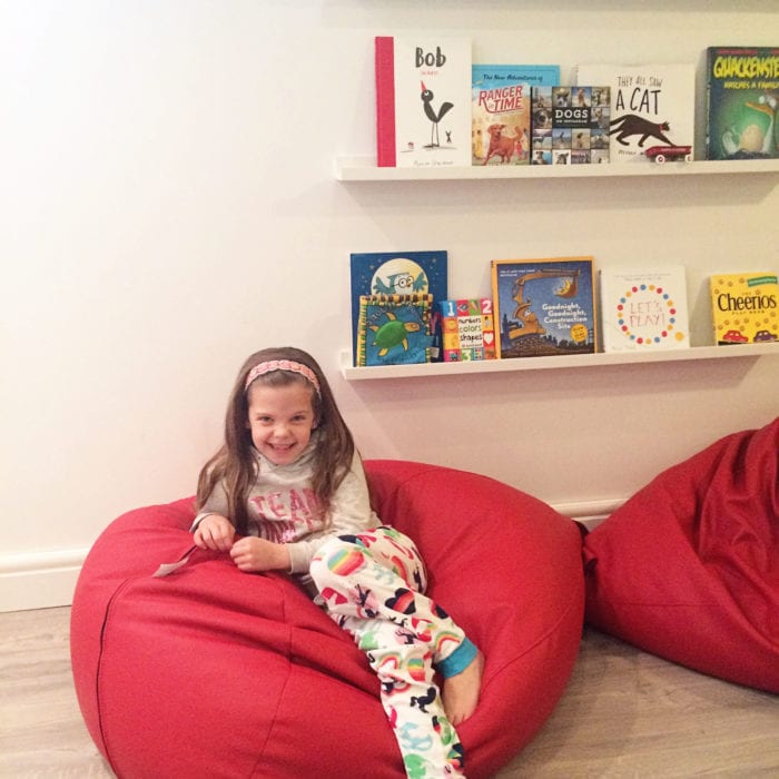 Bright Basement Playroom Reveal - book ledges and leather bean bags