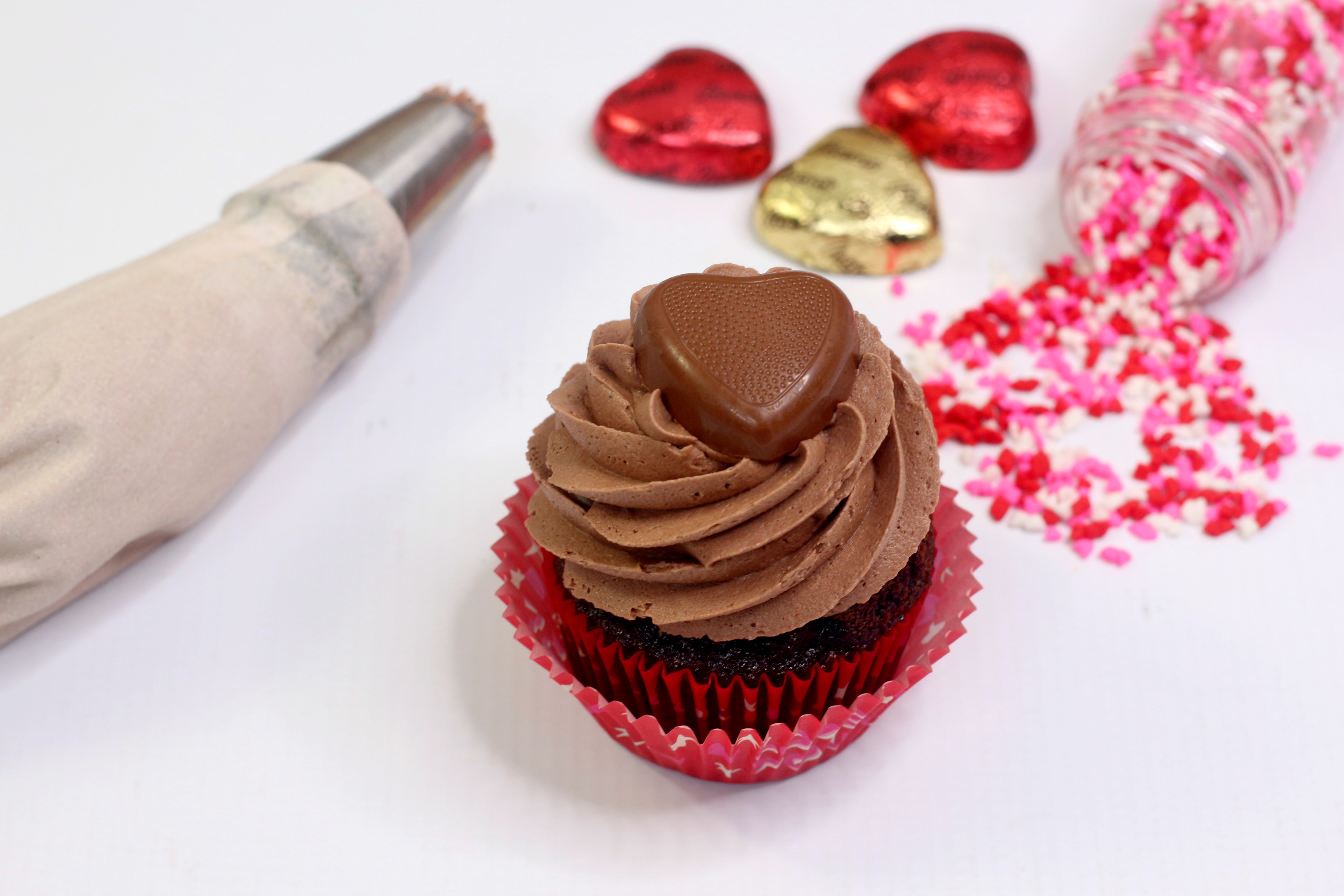Valentines Day Chocolate Peanut Butter cupcakes with heart sprinkles.