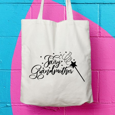 a canvas tote bag with the design of a wand and stars saying fairy grandmother