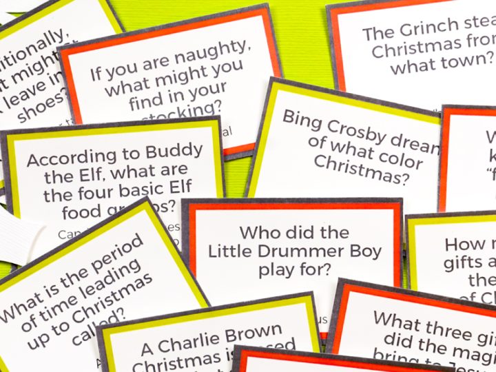 Christmas movie trivia card games on a green background