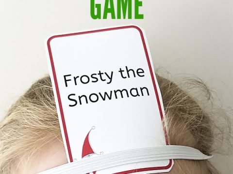 child with card on her head playing a christmas game