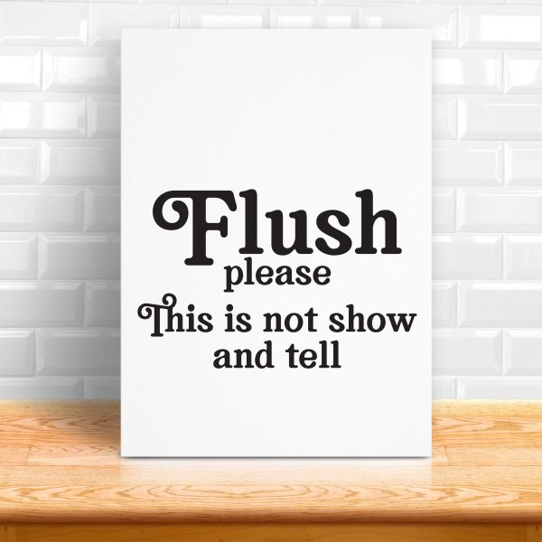 white sign on a wood shelf that says flush please - this is not show and tell. Includes a download to a free svg file to make your own funny bathroom sign