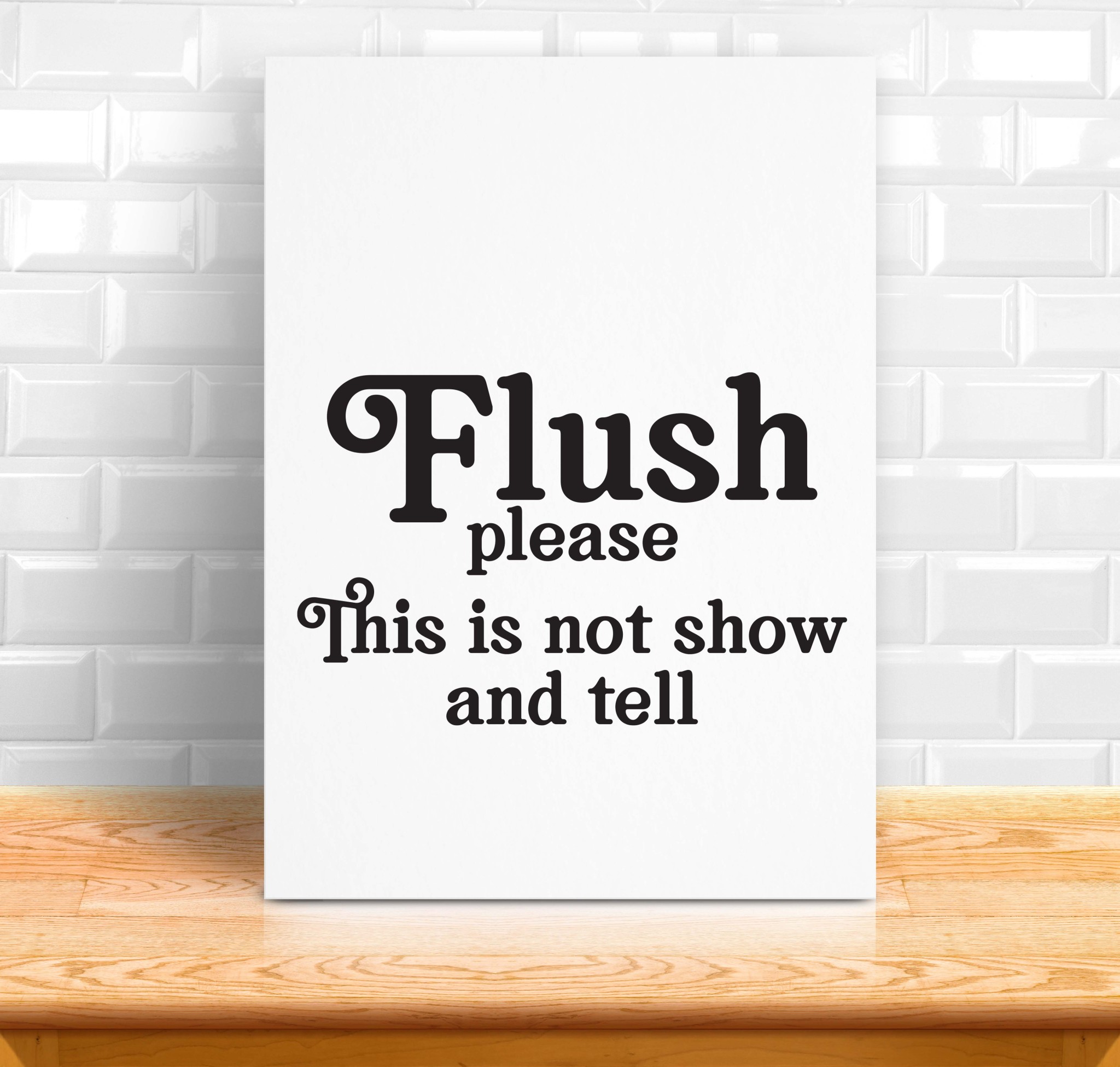white sign on a wood shelf that says flush please - this is not show and tell. Includes a download to a free svg file to make your own funny bathroom sign