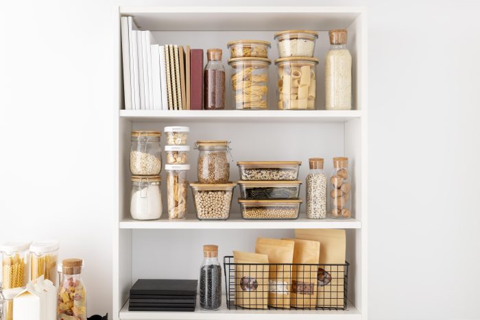 an organized pantry with items in clear containers