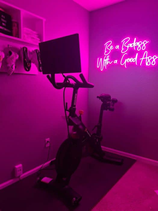 neon light for workout room that says be a badass with a good ass