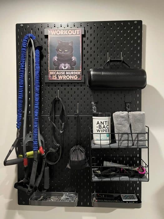 wall pegboard for storing workout equipment