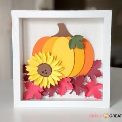 paper cut fall designs in a shadow box