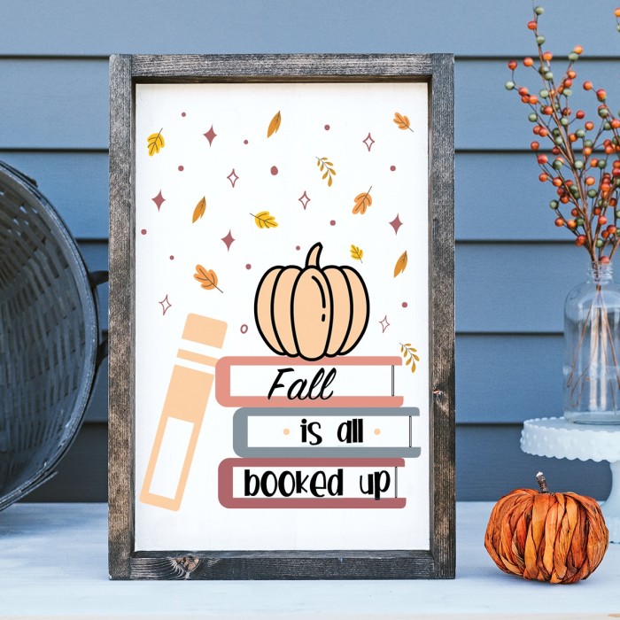 wood sign with a pumpkin and books that says fall is all booked up.