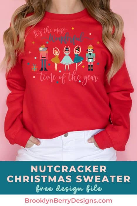 Woman in a red sweatshirt with nutcracker christmas design on it.