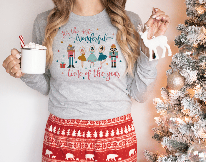 grey sweatshirt with Its The Most wonderful Time Of The Year written across it with images of nutcrackers, ballet dancers, and the mouse king.