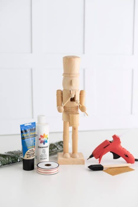 Wooden nutcracker and craft supplies