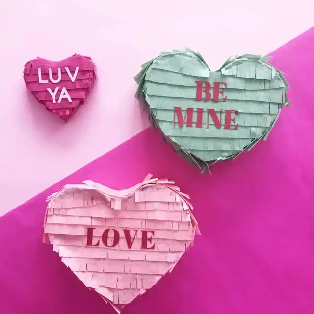 DIY conversation Heart Pinata made from felt, cardboard, and tape.