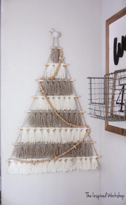 Alternative to a traditional christmas tree. Wall tree made of yarn tassels.