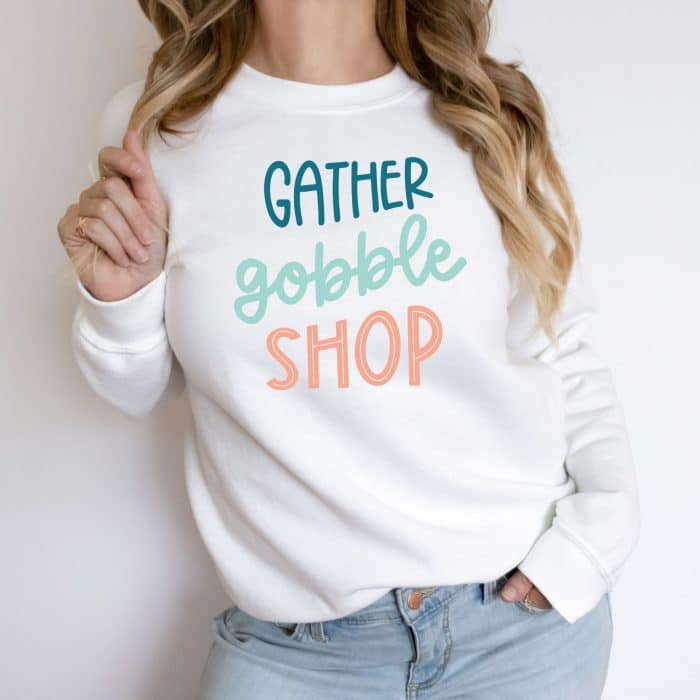 blackfriday svg file shown on a sweatshirt that says gather gobble shop