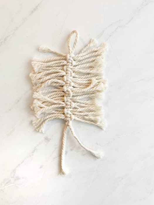 simple macrame cords showing the process of how to make a macrame feather