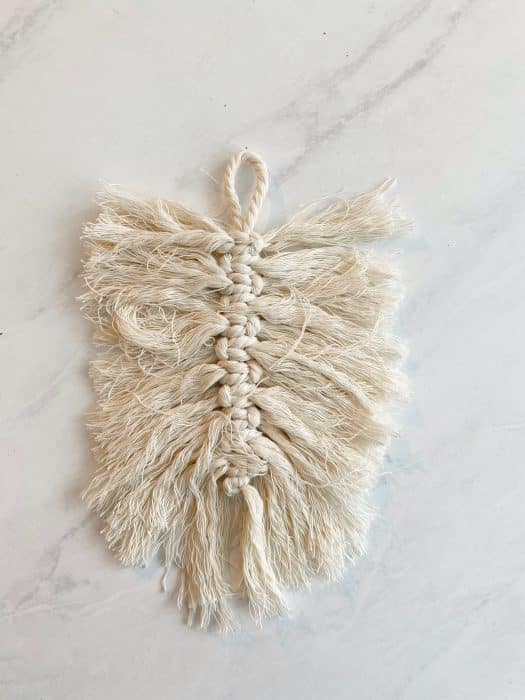 simple macrame cords showing the process of how to make a macrame feather