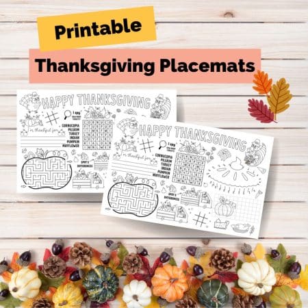 A flatlay image of printed placemats for kids to color on during thanksgiving dinner.
