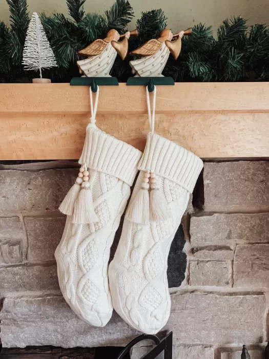 knit stockings with cable knit design and wood bead tassels.