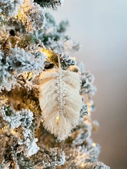macrame feather on a christmas tree for a bohemian christmas decor look.