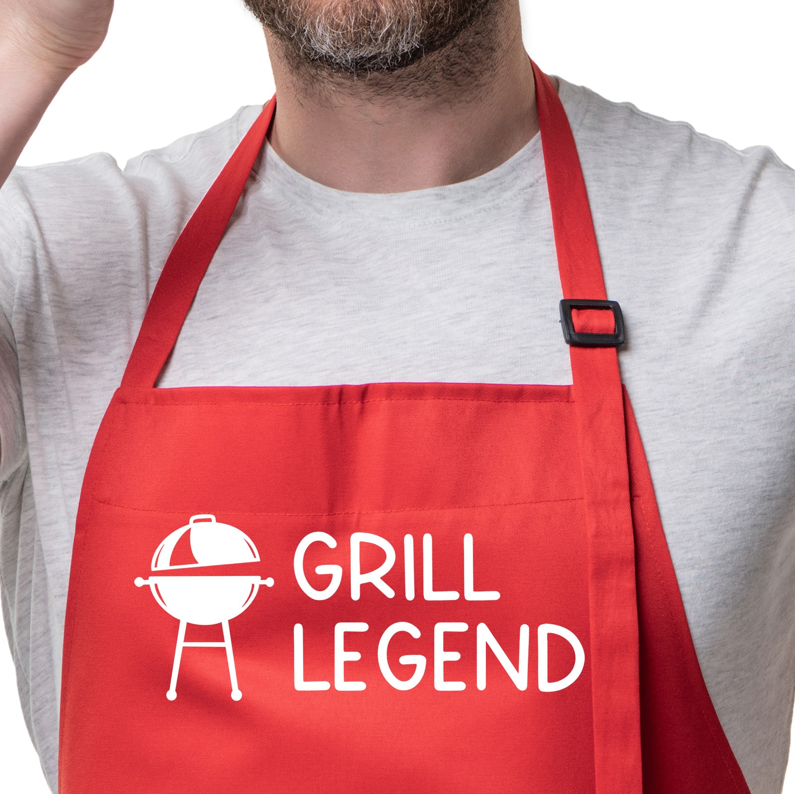 ref apron on a man with the image of a grill and the text grill legend. This post shares a free svg file to make your own version of this apron.